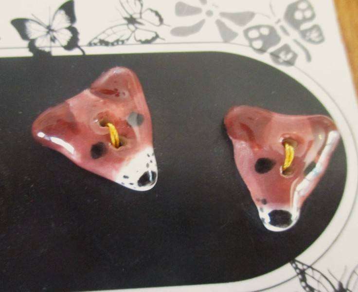 A card of six  hand made ceramic buttons - cute puppy dog faces