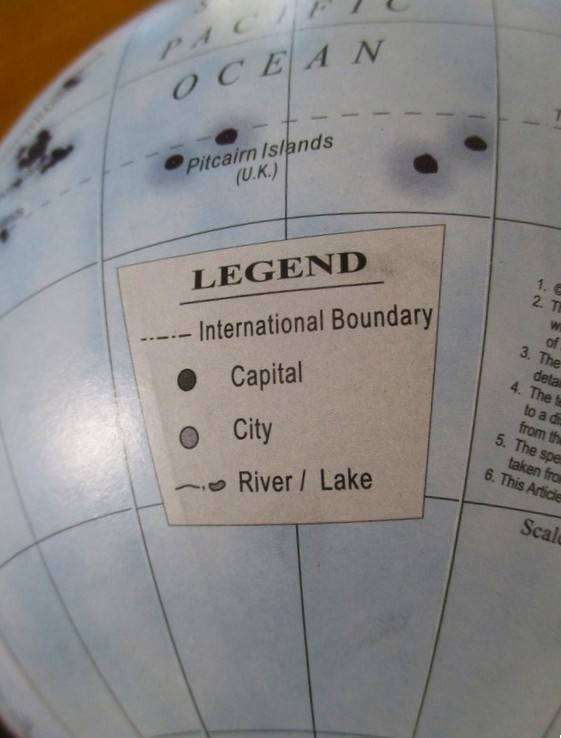 A Legend World Globe in outstanding condition - metal with wood stand