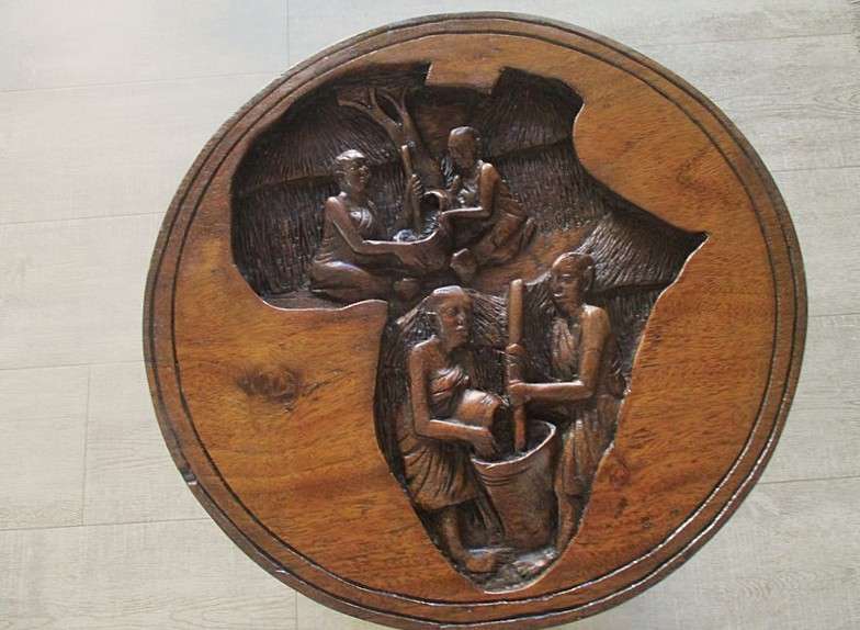 Awesome very heavy hand carved solid wood table from Kampala, Uganda (signed by artist Sekyanzi)
