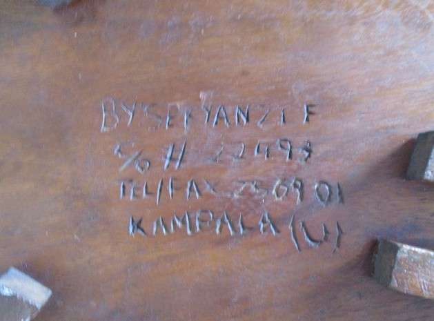 Awesome very heavy hand carved solid wood table from Kampala, Uganda (signed by artist Sekyanzi)