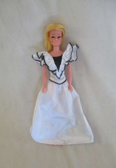 A vintage Barbie clone doll with ""cat eye" make up and beauty spot - made in Hong Kong