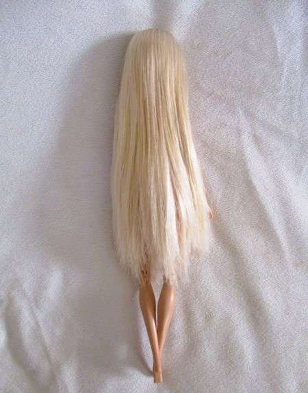 Relisted - An articulated Mattel Barbie doll with very long hair in cute Barbie? tracksuit