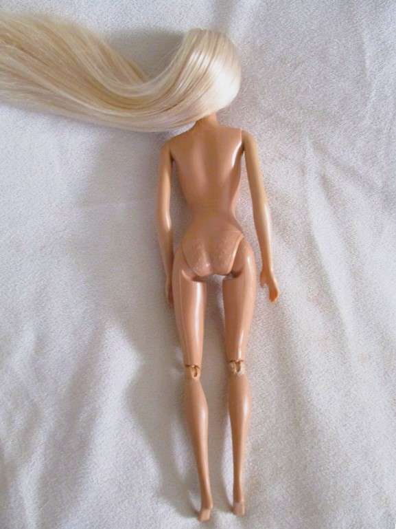 Relisted - An articulated Mattel Barbie doll with very long hair in cute Barbie? tracksuit