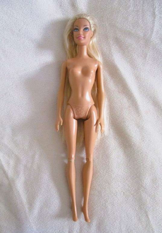 Relisted - An articulated Mattel Barbie doll with very long hair in cute Barbie? tracksuit