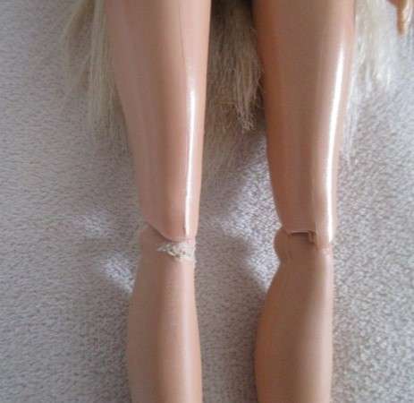 Relisted - An articulated Mattel Barbie doll with very long hair in cute Barbie? tracksuit
