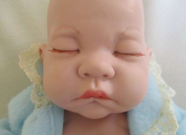 Vinyl (not porcelain) baby doll with cutest mouth