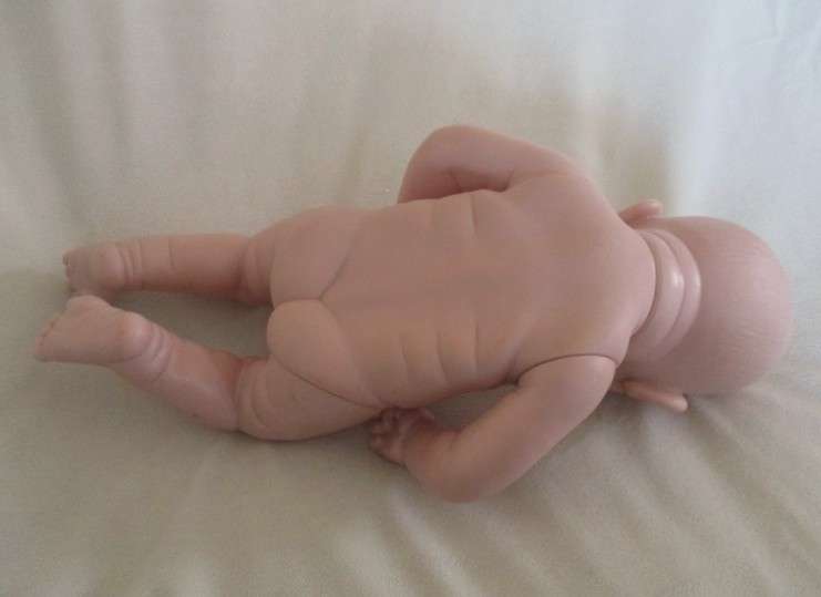 Vinyl (not porcelain) baby doll with cutest mouth