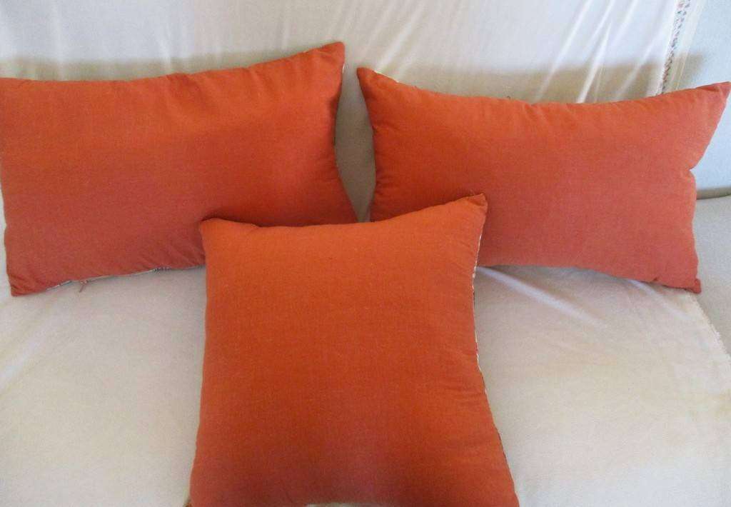 Three striking cushions made from quality woven fabric
