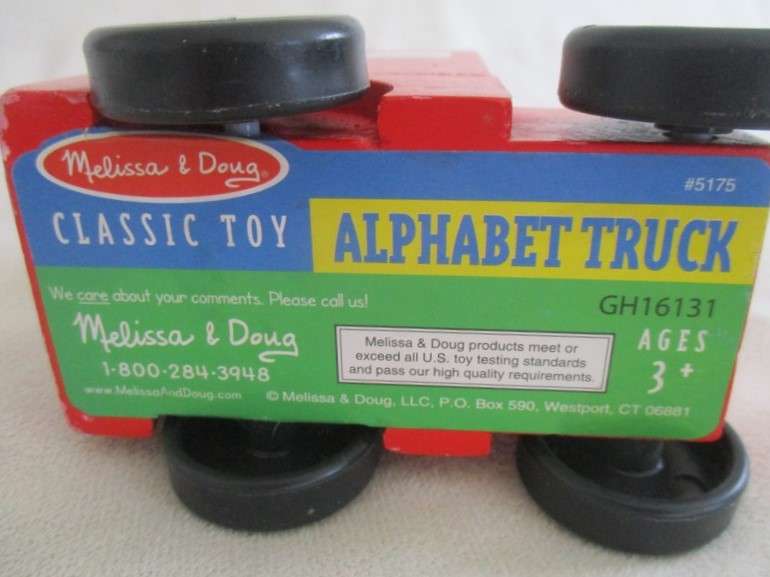 A classic Melissa and Doug wooden alphabet truck