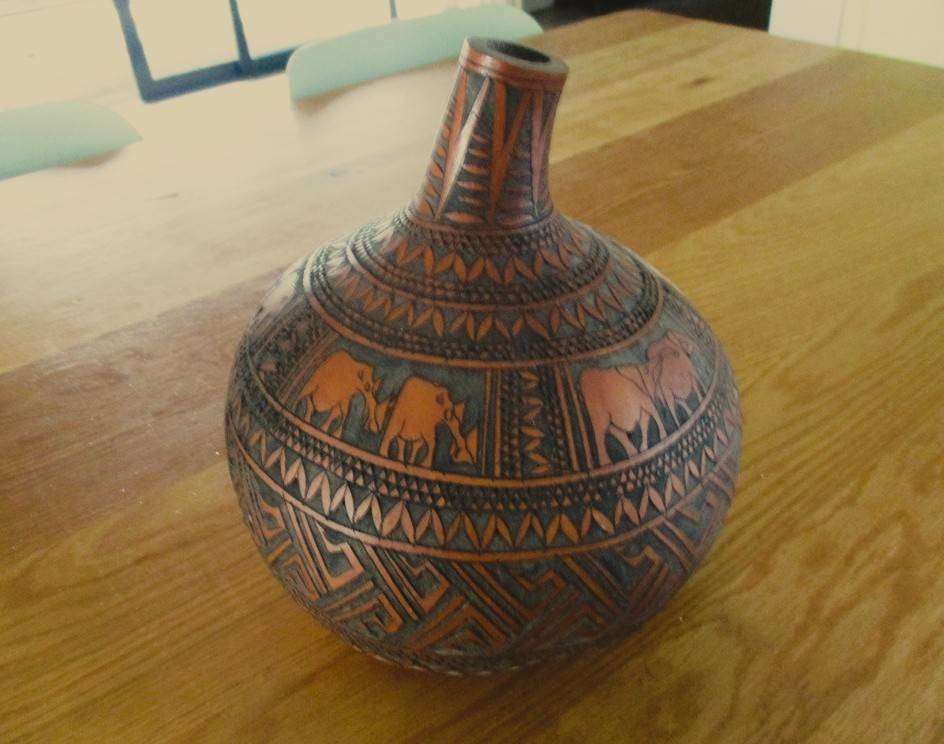 An exceptional  large intricately and artistically carved gourd calabash from Kenya
