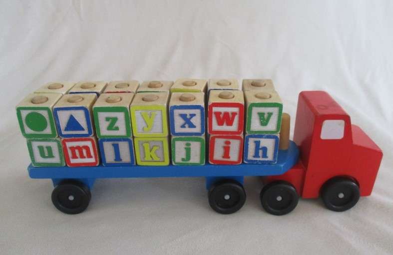 A classic Melissa and Doug wooden alphabet truck