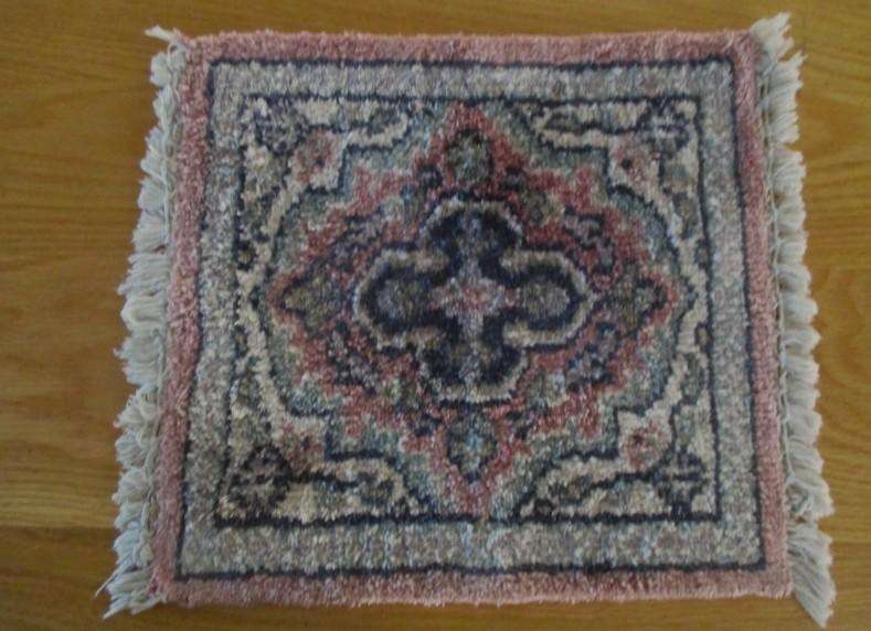 A vintage hand made Persian table mat