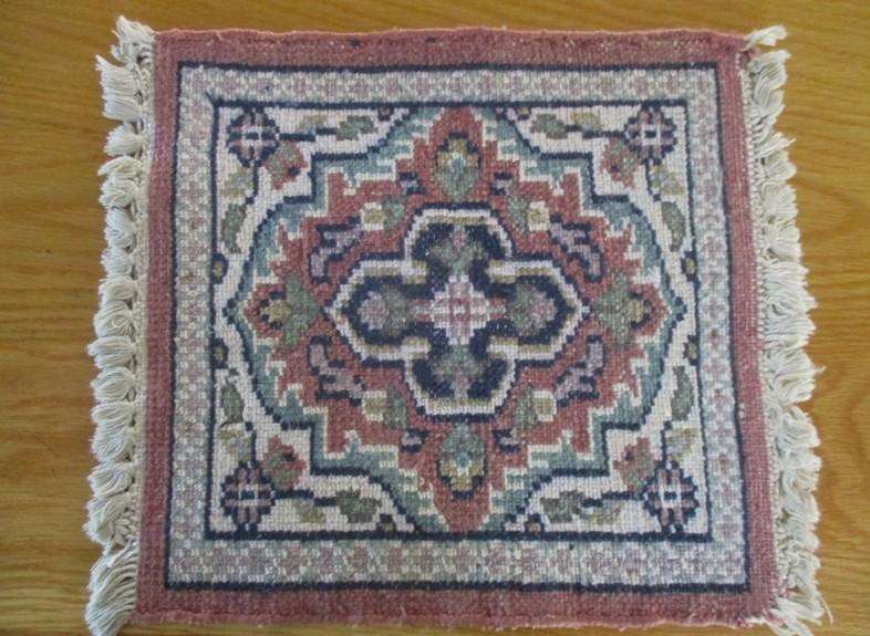 A vintage hand made Persian table mat