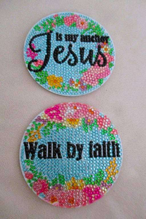 Eight pretty Christian coasters in metal holder
