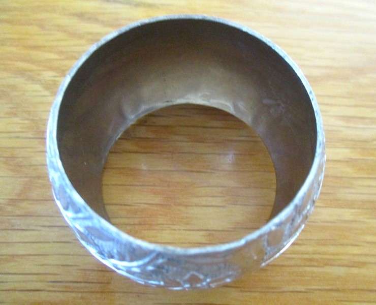 A  set of six vintage, very decorative etched silver metal serviette rings