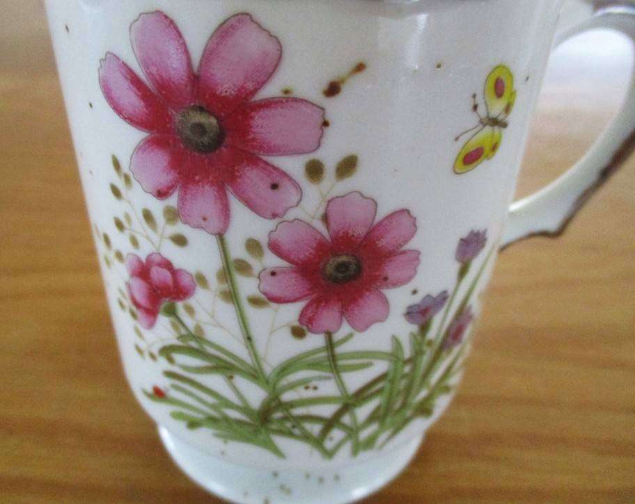 Four pretty country style coffee mugs with rustic floral designs