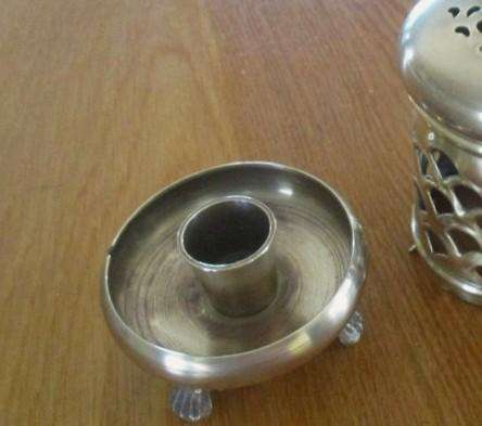 A lovely ornate footed brass lantern-style candle holder