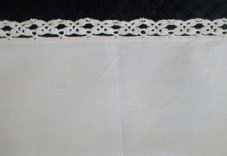 A vintage,  expertly embroidered square cloth with anemones and crocheted border