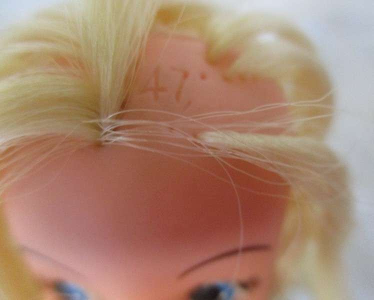 A vintage and unusual 1960's Sindy doll with numbers under hair