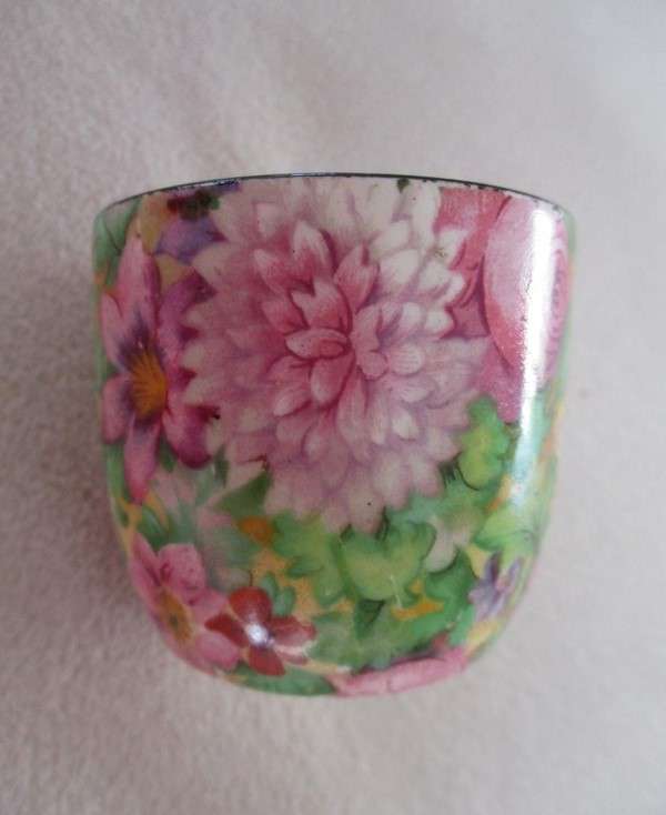 A vintage/antique Chintz egg cup marked "HP" on base