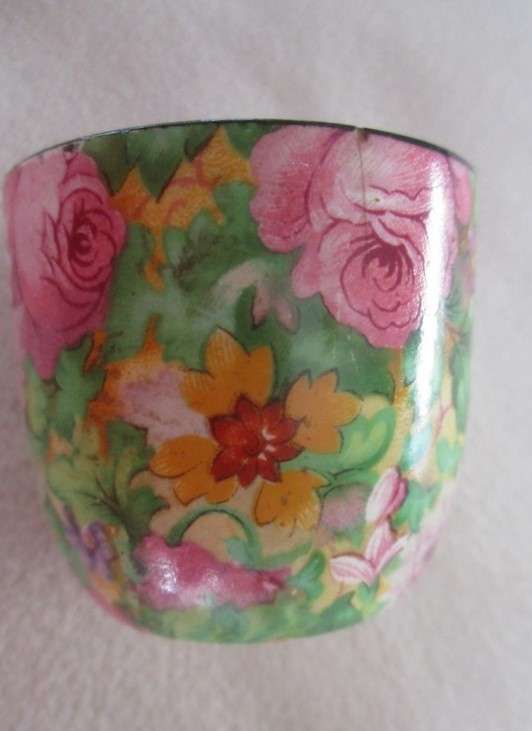 A vintage/antique Chintz egg cup marked "HP" on base