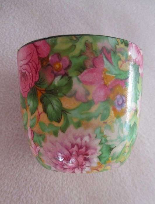 A vintage/antique Chintz egg cup marked "HP" on base