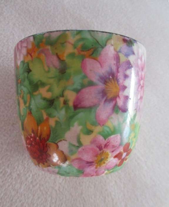 A vintage/antique Chintz egg cup marked "HP" on base