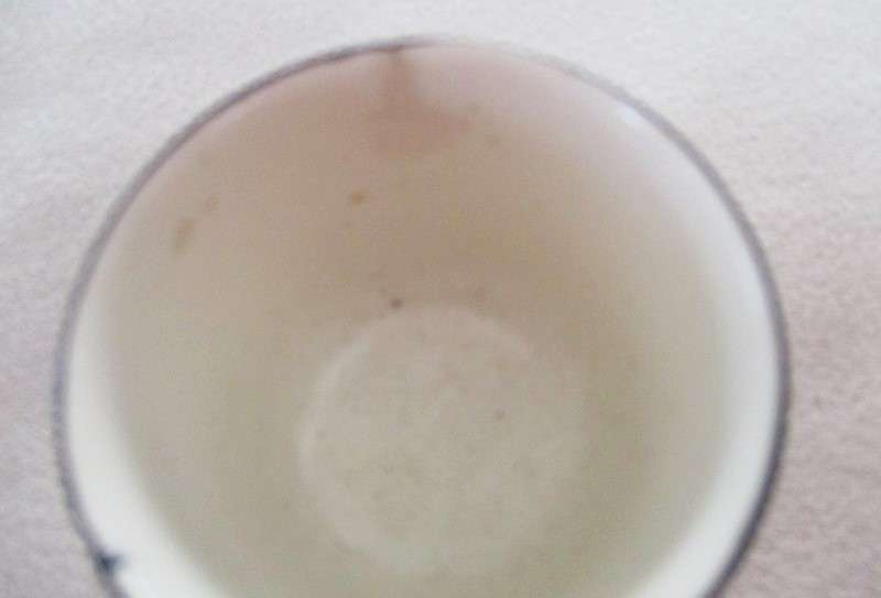 A vintage/antique Chintz egg cup marked "HP" on base