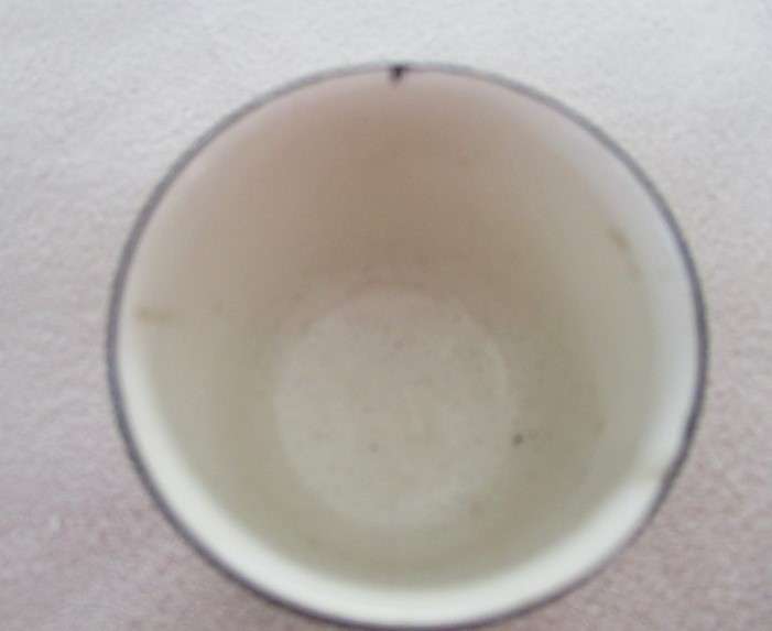 A vintage/antique Chintz egg cup marked "HP" on base