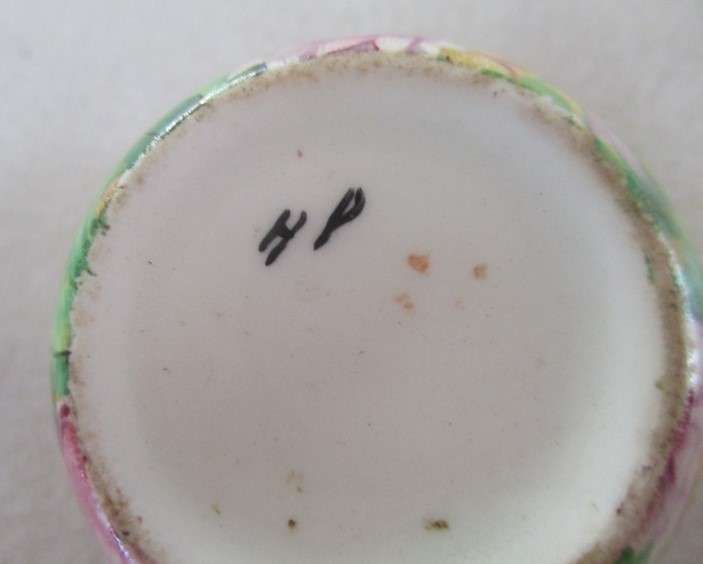 A vintage/antique Chintz egg cup marked "HP" on base