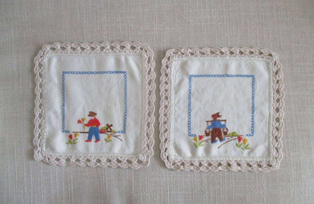 Two pretty hand embroidered cloths depicting Dutch boys with hand crocheted borders