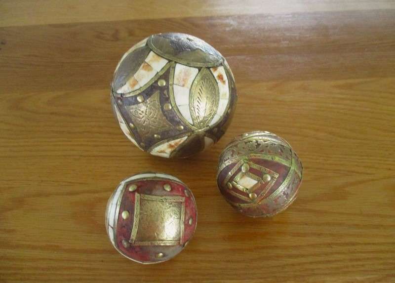 Three heavy vintage Middle Eastern bone and brass inlaid balls - very decorative