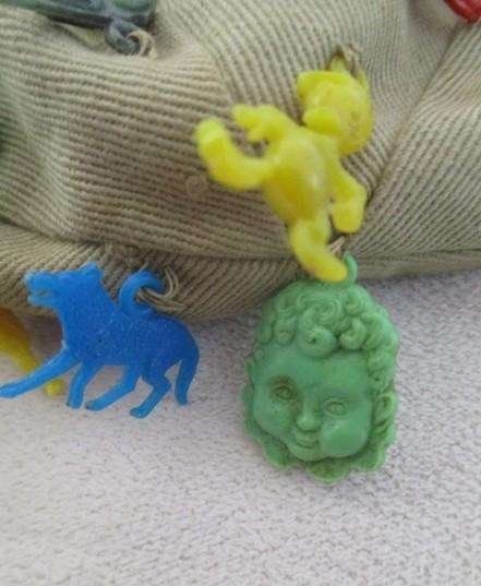 Vintage plastic charms - 62 of them on an old khaki hat!