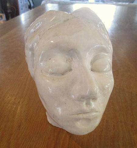 A vintage shabby chic glazed pottery head for inside or outside