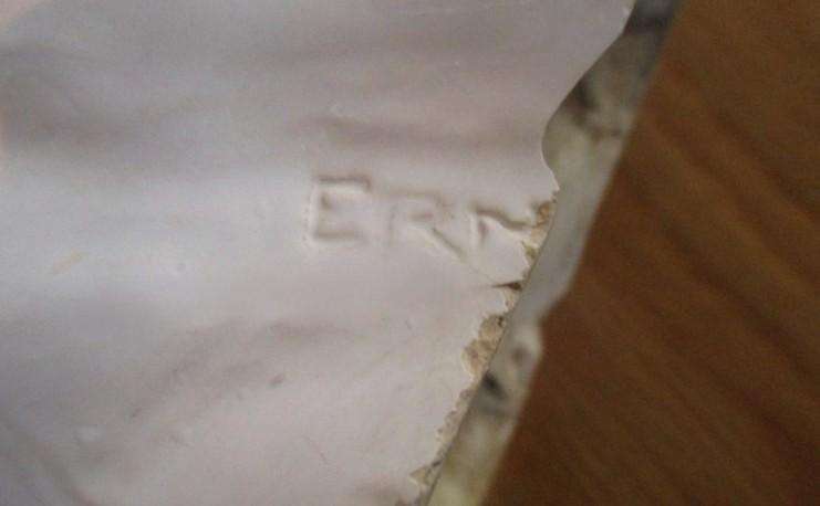 A vintage shabby chic glazed pottery head for inside or outside