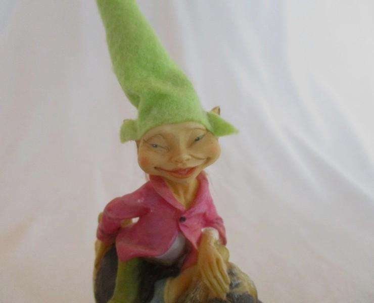 Cute cheeky-faced pixie on his hound