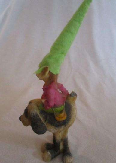 Cute cheeky-faced pixie on his hound