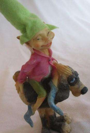 Cute cheeky-faced pixie on his hound