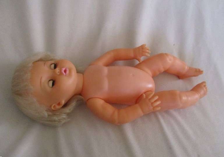 Pretty vintage First Love Baby Love drink and wet doll in pretty outfit