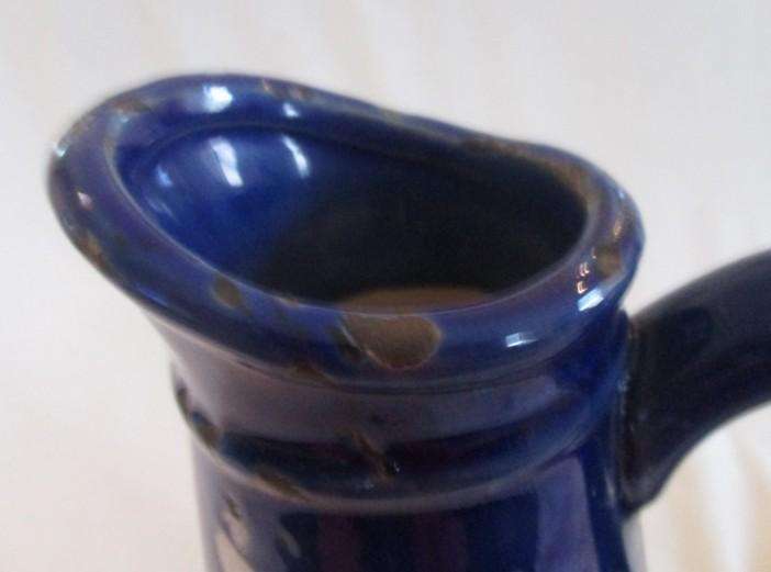 Large, unique purposefully antique-looking ceramic jug vase made to resemble aged enamel