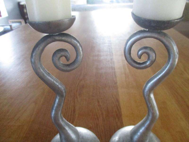 Two ornate pewter candle holders