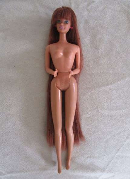 A Mattel Barbie with gorgeous EXTRA long red hair in colourful gypsy outfit with boots - knees bend