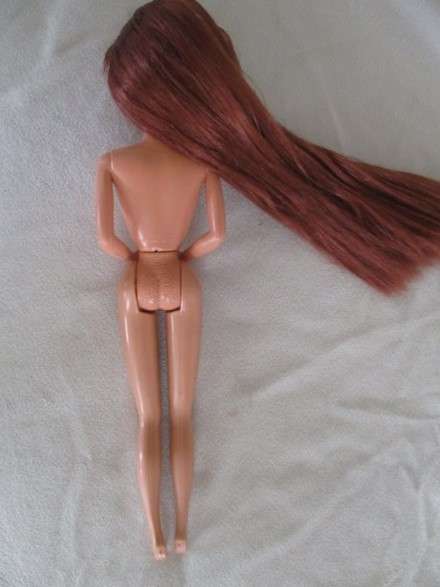 A Mattel Barbie with gorgeous EXTRA long red hair in colourful gypsy outfit with boots - knees bend