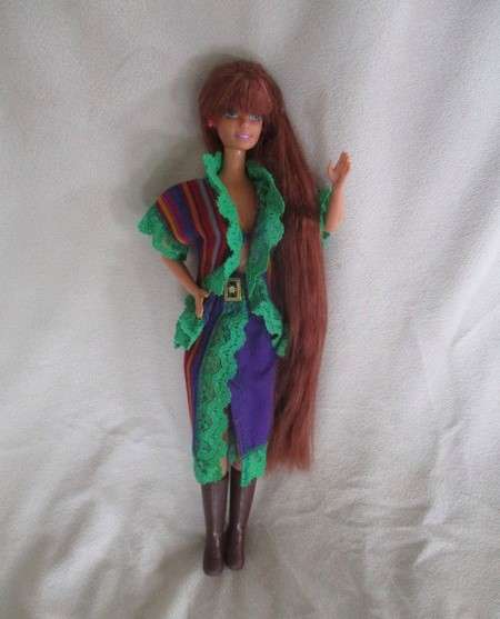 A Mattel Barbie with gorgeous EXTRA long red hair in colourful gypsy outfit with boots - knees bend