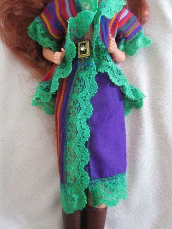 A Mattel Barbie with gorgeous EXTRA long red hair in colourful gypsy outfit with boots - knees bend