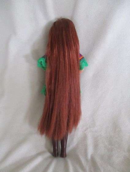 A Mattel Barbie with gorgeous EXTRA long red hair in colourful gypsy outfit with boots - knees bend