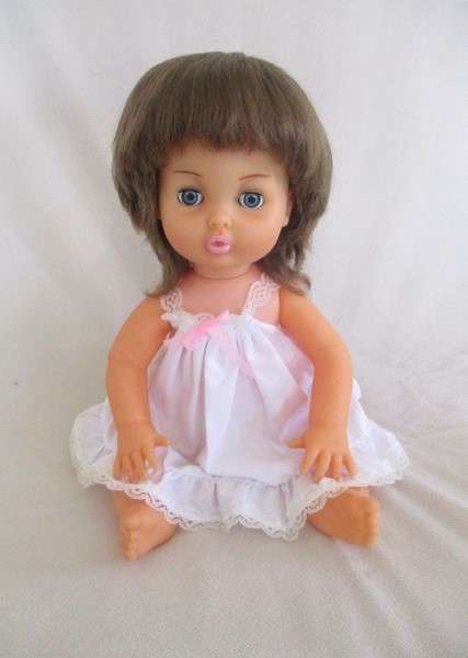 Vintage 40cm First Love brunette doll in original dress