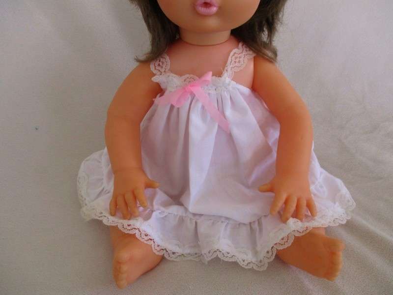 Vintage 40cm First Love brunette doll in original dress