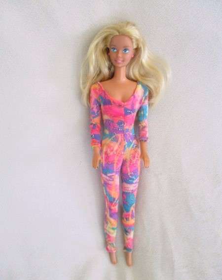 A Vintage 1980's Mattel Barbie doll with knees that bend in pretty jumpsuit