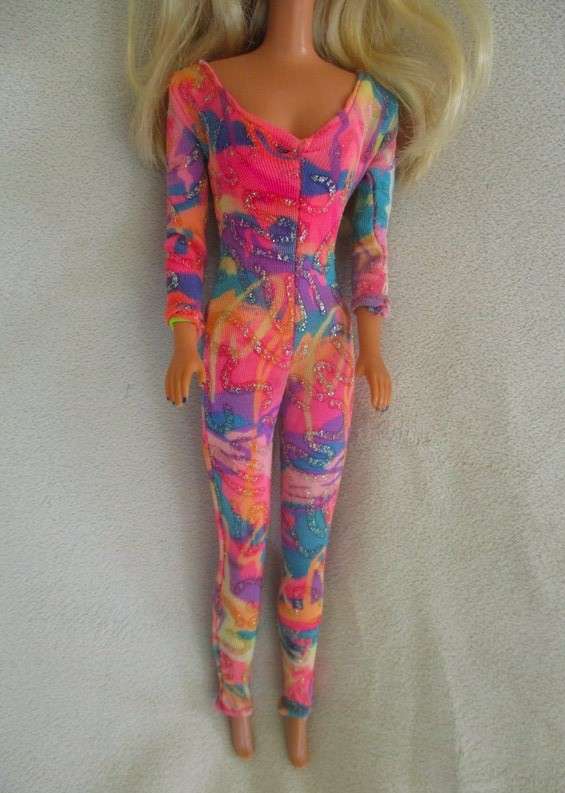 A Vintage 1980's Mattel Barbie doll with knees that bend in pretty jumpsuit